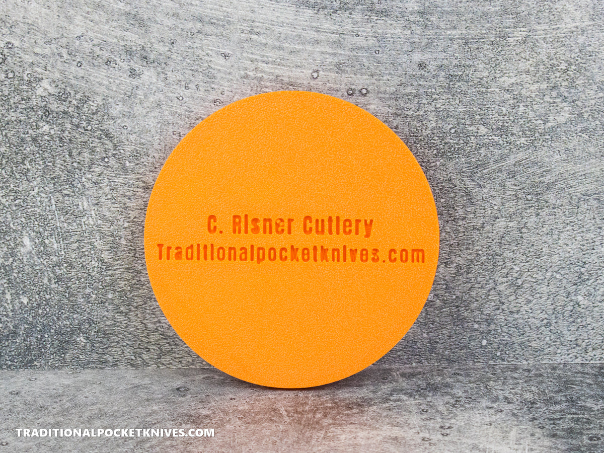 C. Risner Cutlery "The Walk & Talk Newsletter" Coaster - Orange