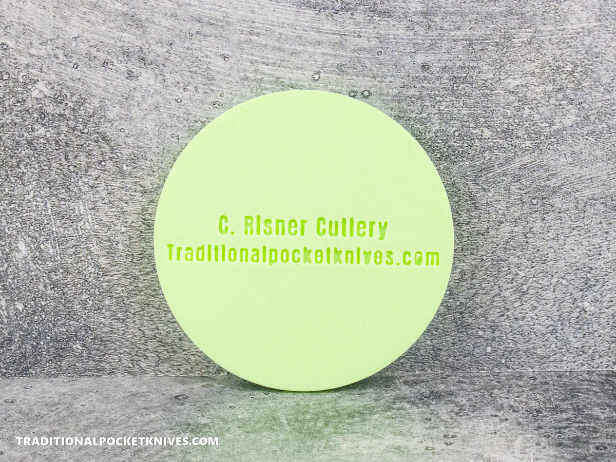 C. Risner Cutlery "The Walk & Talk Newsletter" Coaster - Glow in the Dark Green