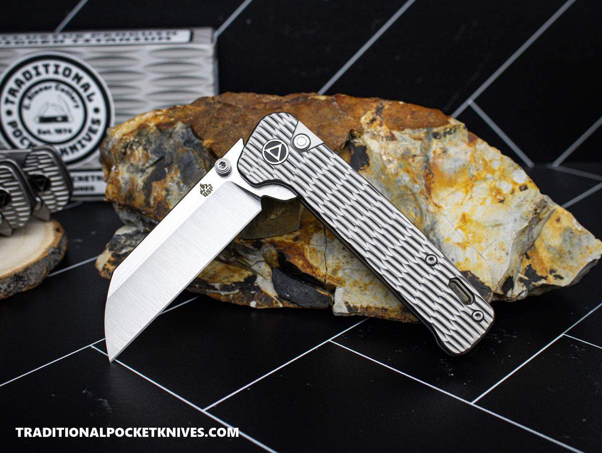 QSP Exclusive Penguin Button Lock Knife Gray Jigged Titanium