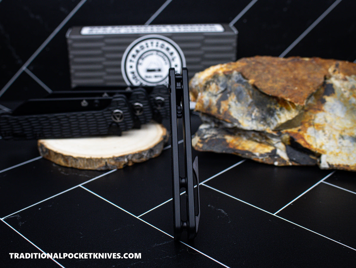 QSP Exclusive Penguin Button Lock Knife Black Jigged Titanium