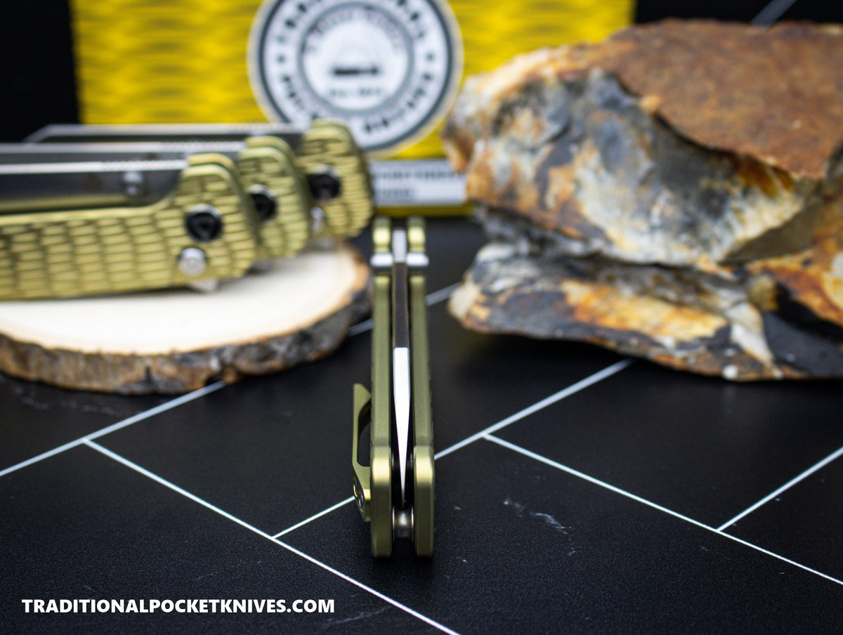 QSP Exclusive Penguin Button Lock Knife Gold Jigged Titanium