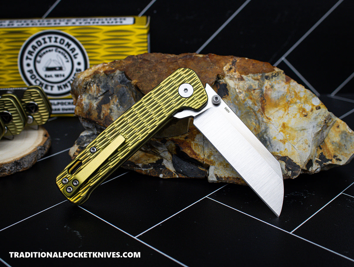 QSP Exclusive Penguin Button Lock Knife Gold Jigged Titanium